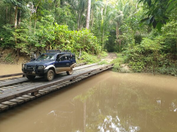 This is a picture of a 4x4 vehicle complete a river crossing in Guyana. 4 X 4 Off-Road Adventure in the Rupununi