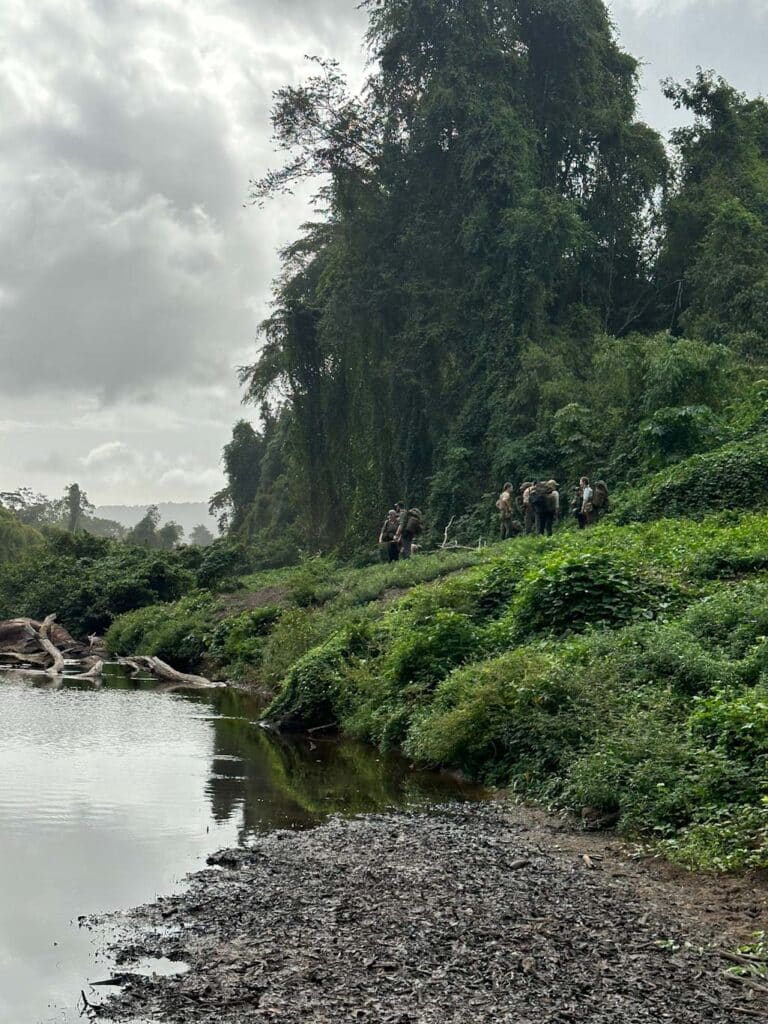 Group on jungle expedition by river in Guyana