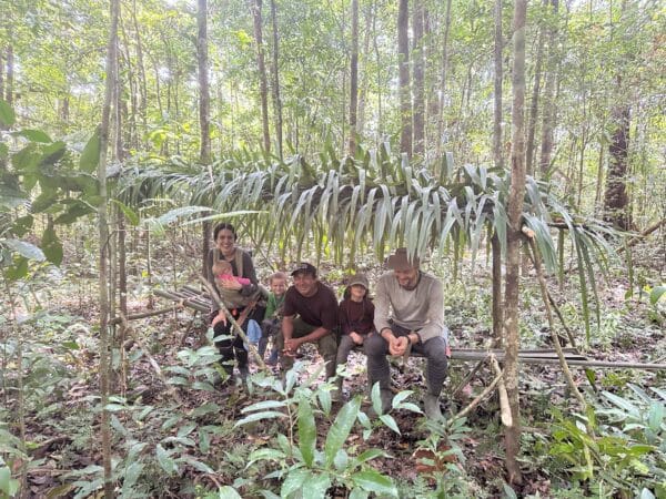 Family in jungle survival shelter in Guyana