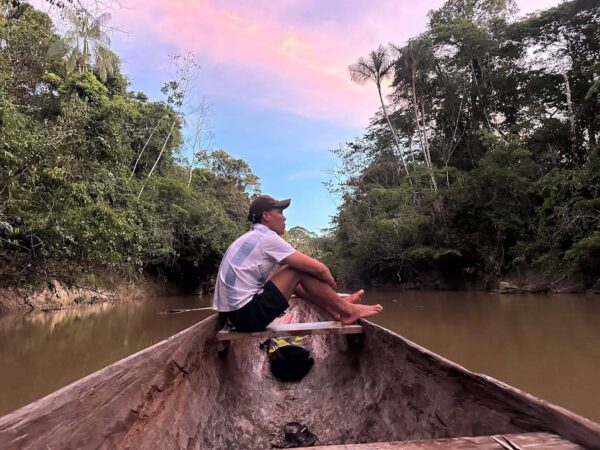 Travelling in traditional canoe on Wai Wai remote tribe expedition